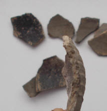 Черепки горшка в котором был клад серебряного пояса