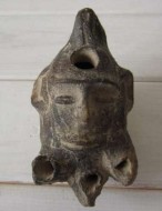 Греко-римская масляная лампа виде головы