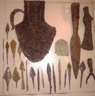 бронзовая иконка-оберег, топор-чекан. наконечник копья, наральник, и другие изделия из железа