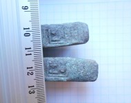 Две ллатежные гривны с начерканным знаком Бату. XIII-пер. пол XIV вв.