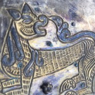 серебряная накладка с изображением зверей