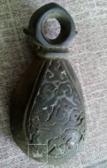 Полый бронзовый кистень с черненным рельефом