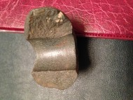 Фрагмент каменного топора с валиком, опоясывающим проушину