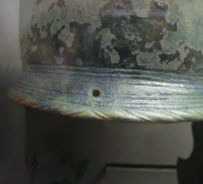 Затылок шлема Кассасельватика с отверстием под крепление колец для шнурка.
