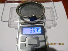 Древнерусский серебряный псевдовитой браслет с фигурными расширениями на кончиках, украшенными чернью, вес: 37 грамм.